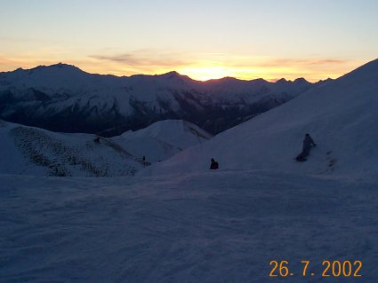 As night falls while still skiing into the night